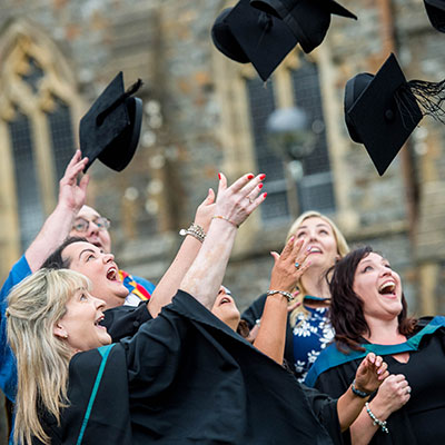 Graduates throwing hats