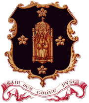 The burgundy-and-gold coat of arms of the University of Wales, Lampeter with the motto Gair Duw Goreu Dysg.