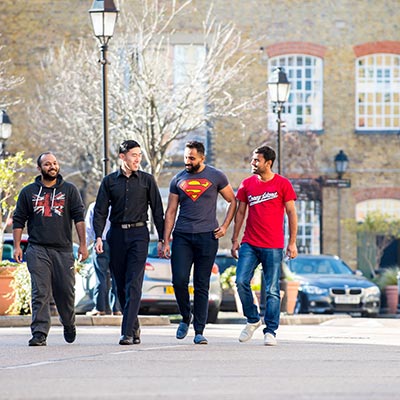 a group of students walking in London